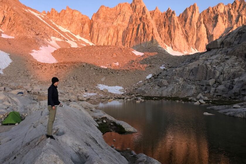 A hiker at Trail Camp just below the summit of Mt. Whitney.