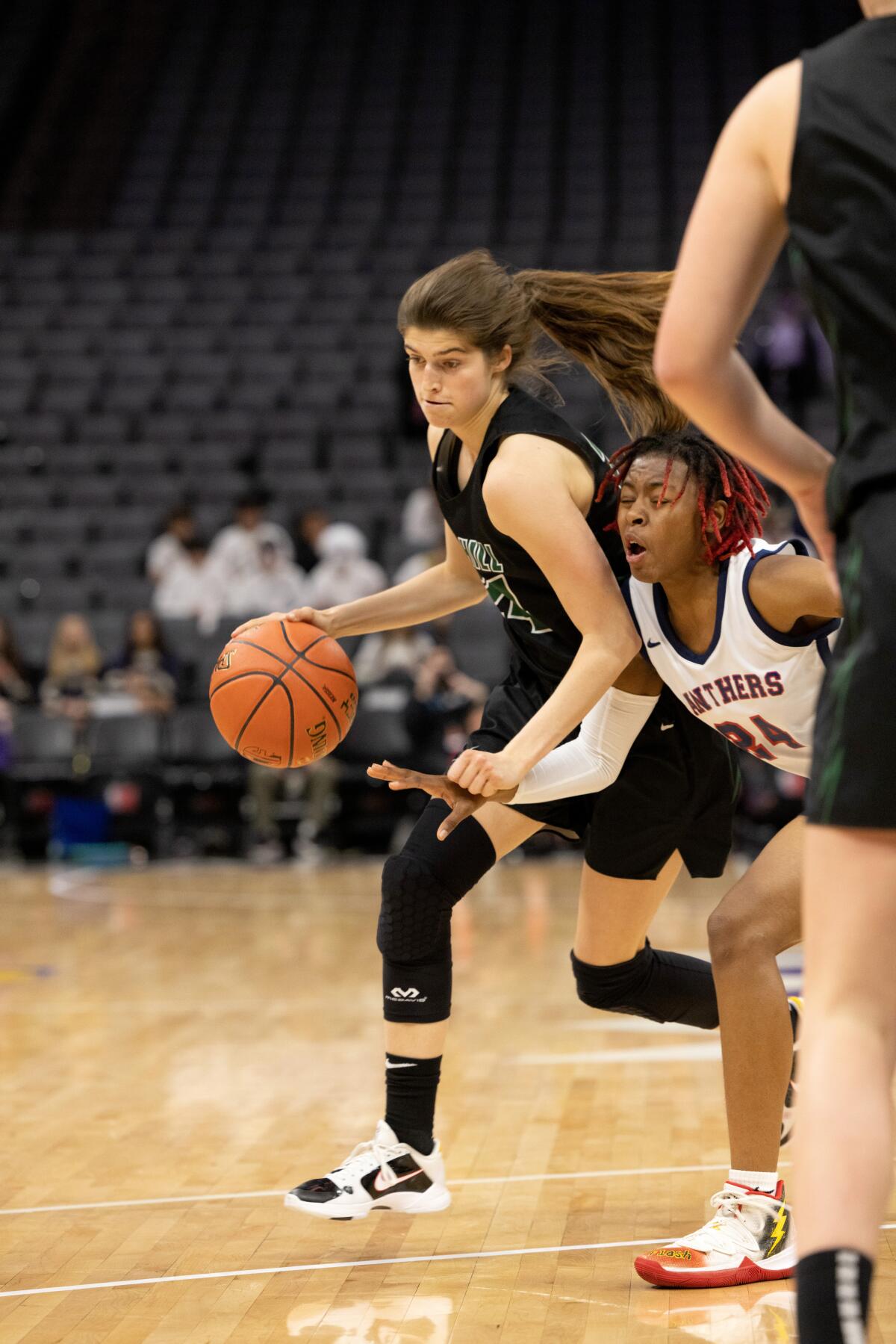 Sage Hill's Isabel Gomez drives against Fresno San Joaquin Memorial's Malaysia Williams in the CIF State Division II final.