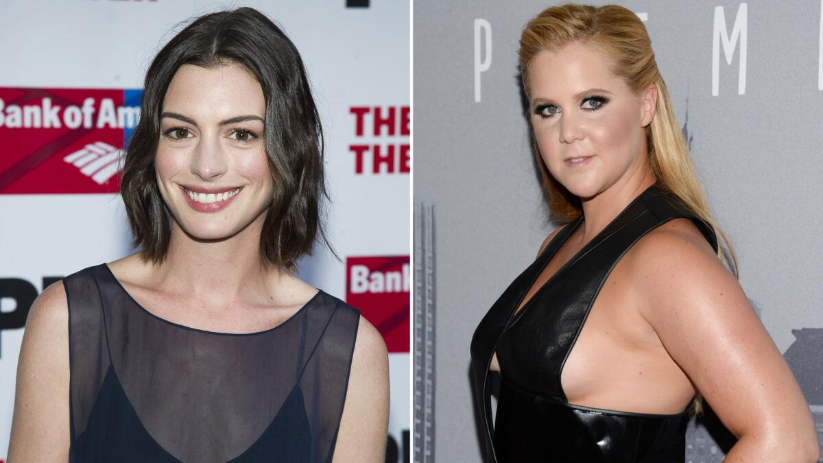 Anne Hathaway, left, praises Amy Schumer, right, despite her Oscars joke in "Trainwreck."