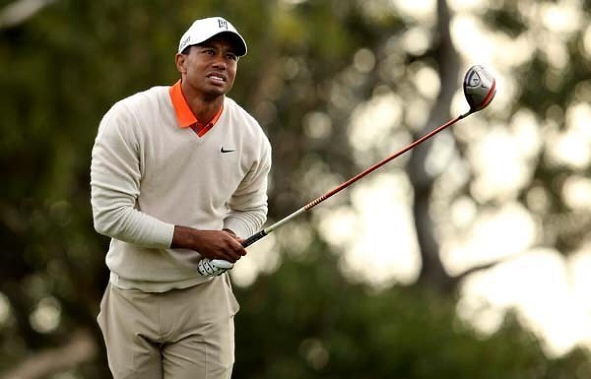 Tiger Woods watches his tee shot at No. 15 during the first round of the Farmers Insurance Open on Thursday at Torrey Pines.