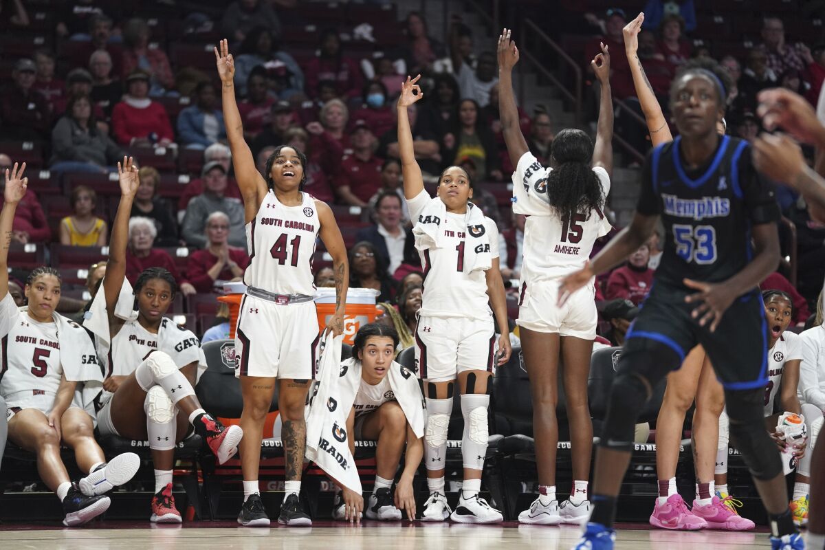 South Carolina players react to a three point attempt during the second half of an NCAA college basketball game against Memphis Saturday, Dec. 3, 2022, in Columbia, S.C. South Carolina won 79-54.(AP Photo/Sean Rayford)