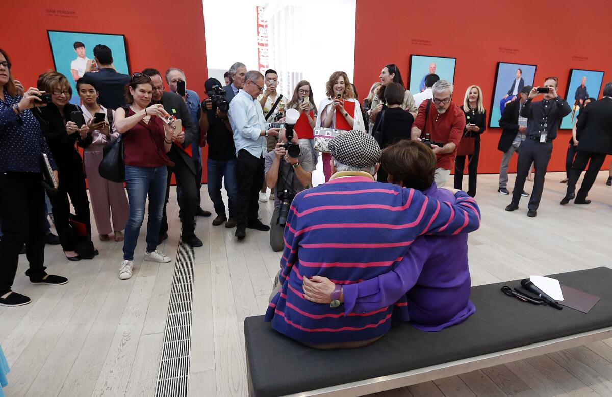 David Hockney poses for pictures with curator Stephanie Barron during an opening event for the LACMA exhibition.