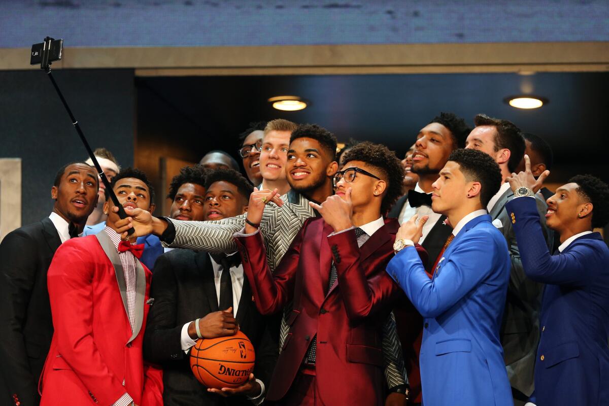 Karl-Anthony Towns holds a selfie stick as other top draft prospects gather for a photo ahead of the 2015 NBA draft at Barclays Center in Brooklyn, N.Y.