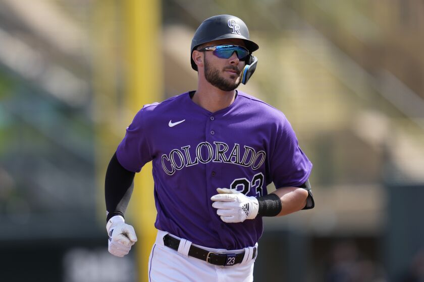 Colorado Rockies designated hitter Kris Bryant (23) runs the bases after hitting a home run during the first inning of a spring training baseball game against the Chicago Cubs in Scottsdale, Ariz., Sunday, March 5, 2023. (AP Photo/Ashley Landis)