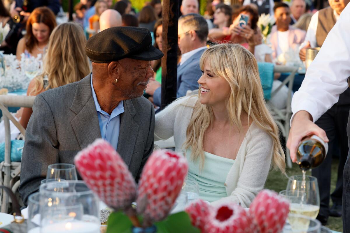 Honoree Morgan Freeman talks with Reese Witherspoon at Oceana’s SeaChange Summer Party.