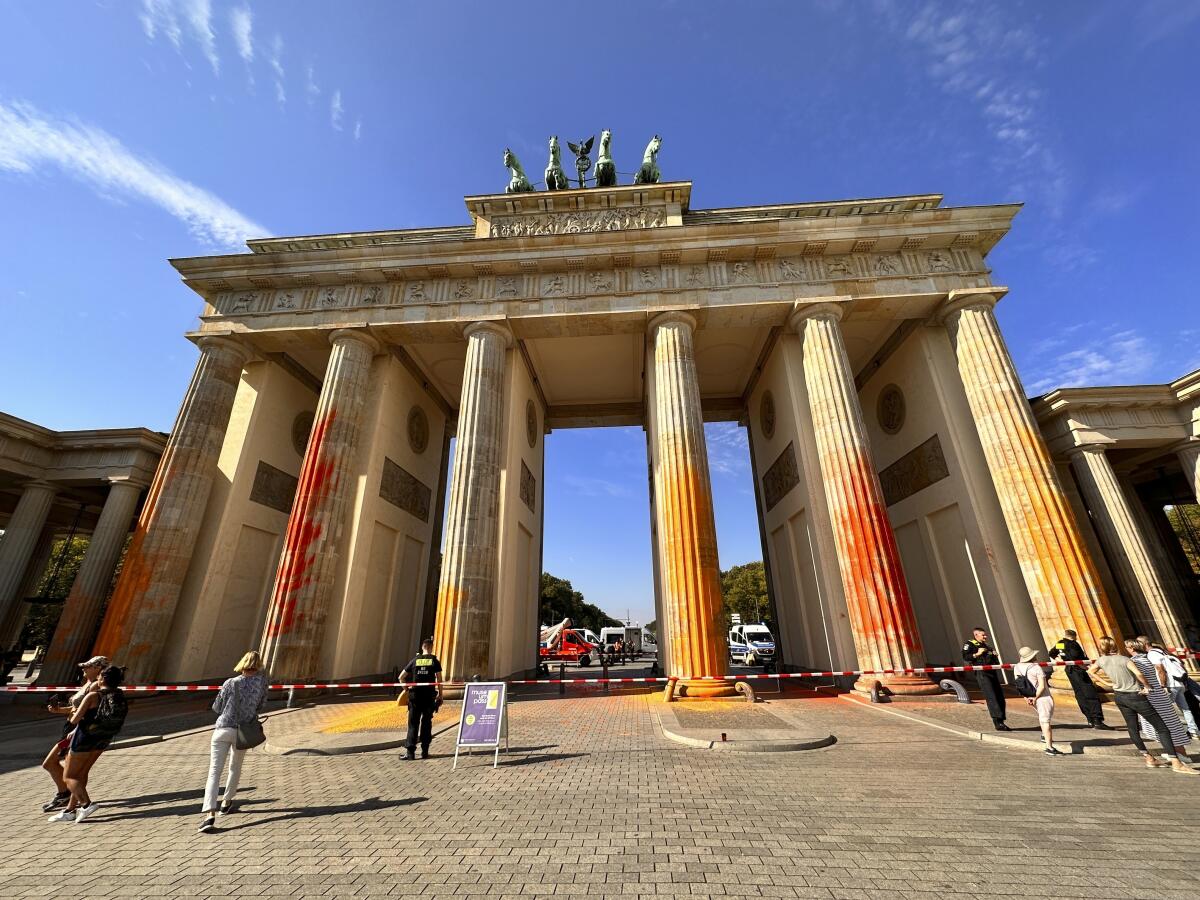 The Brandenburg Gate, sprayed with orange paint.