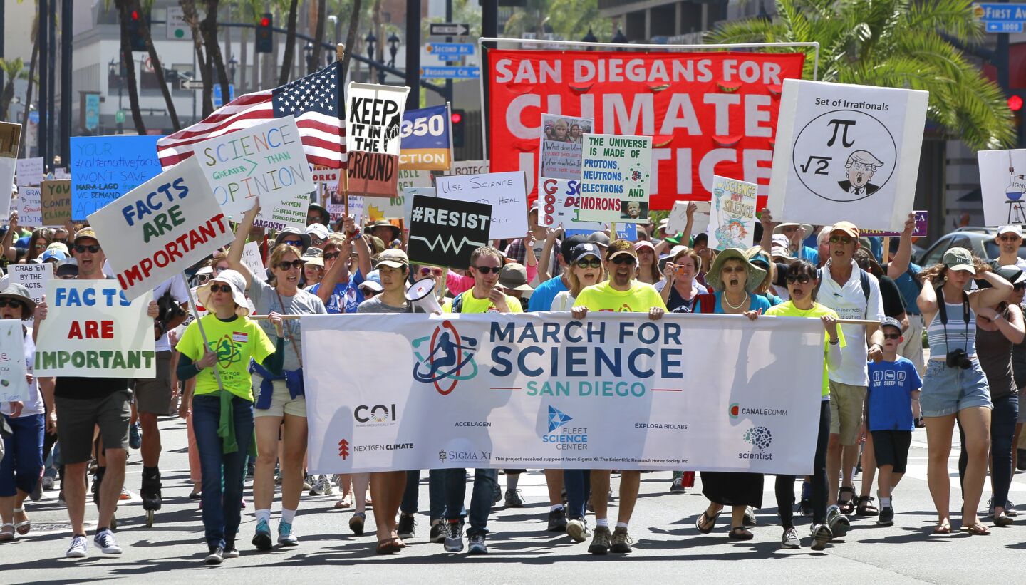 People at the front of the March for Science make their way down Broadway.