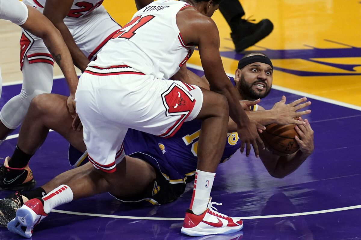 Lakers forward Jared Dudley asks for a timeout after grabbing a loose ball against the Bulls.