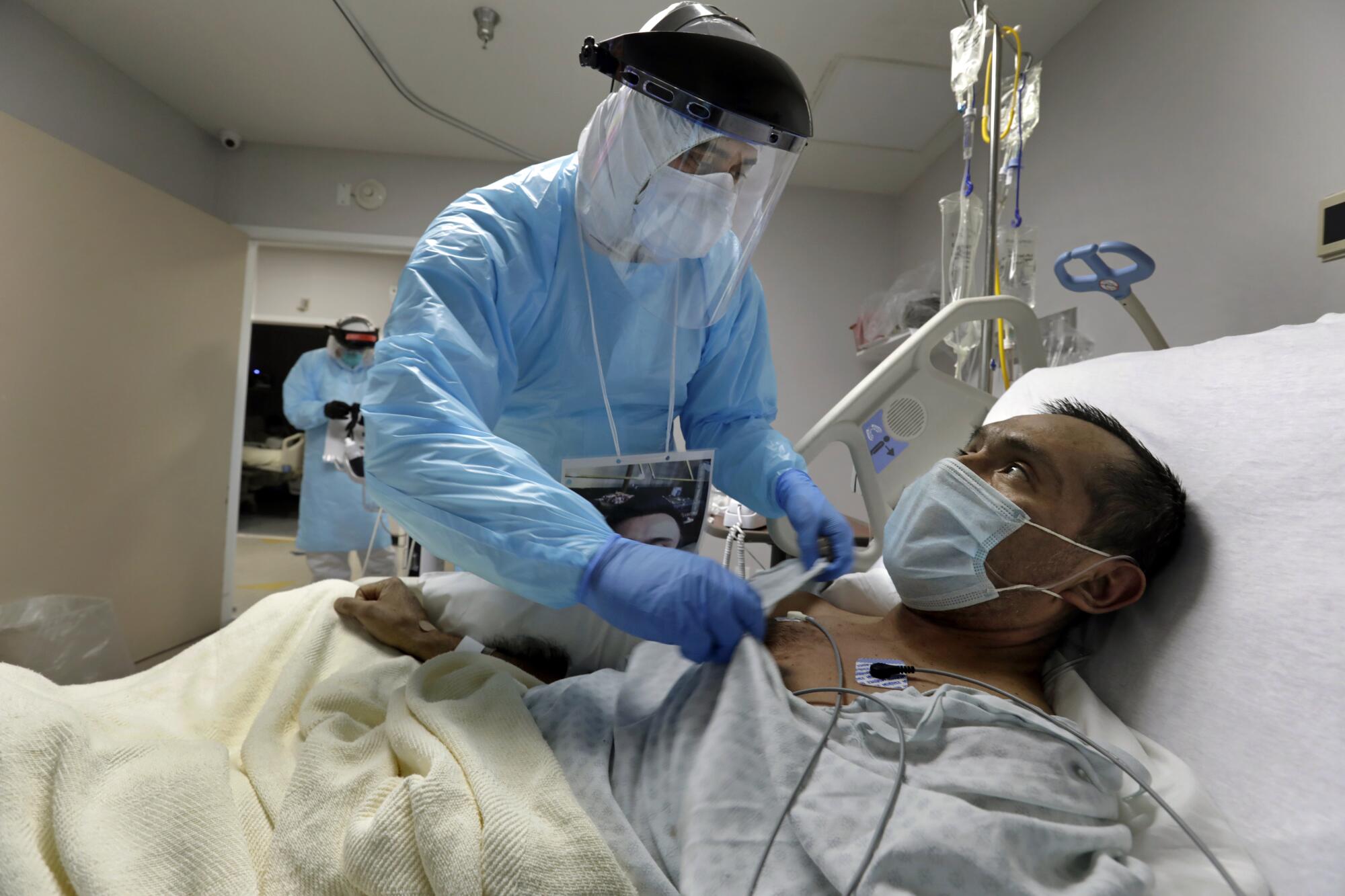 Diego Montelongo treats a COVID-19 patient 