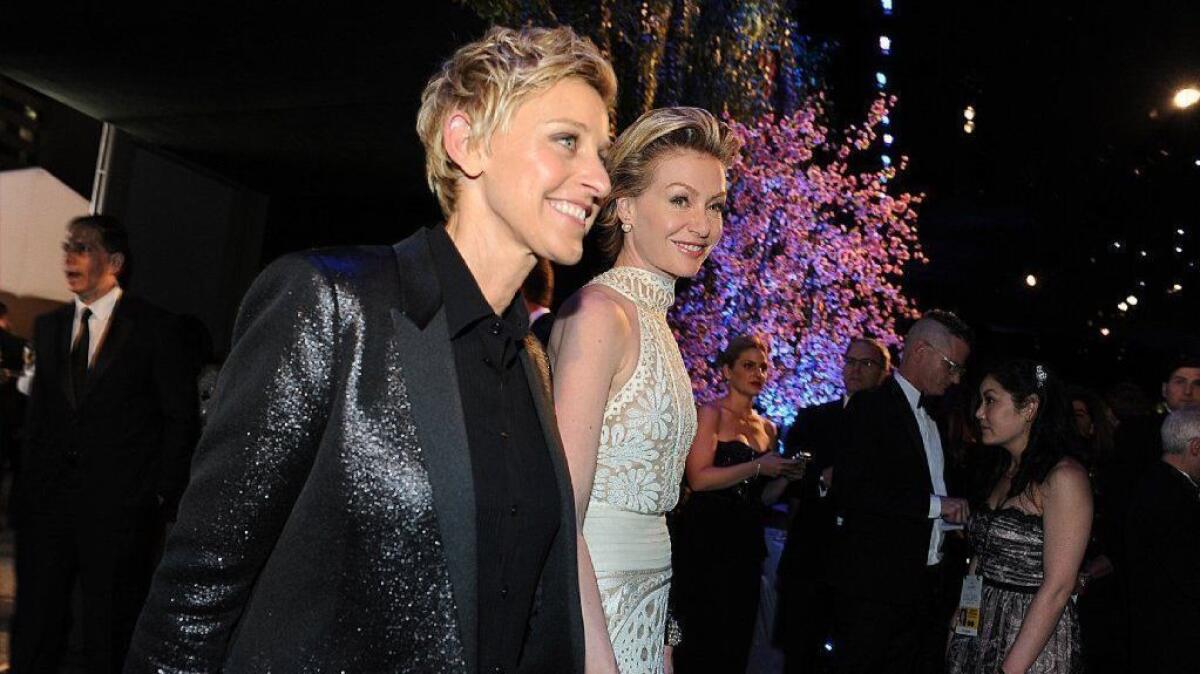 Ellen DeGeneres, left, and Portia de Rossi, at the 2014 Oscars' Governors Ball, bought their Hollywood Regency-style house in September.