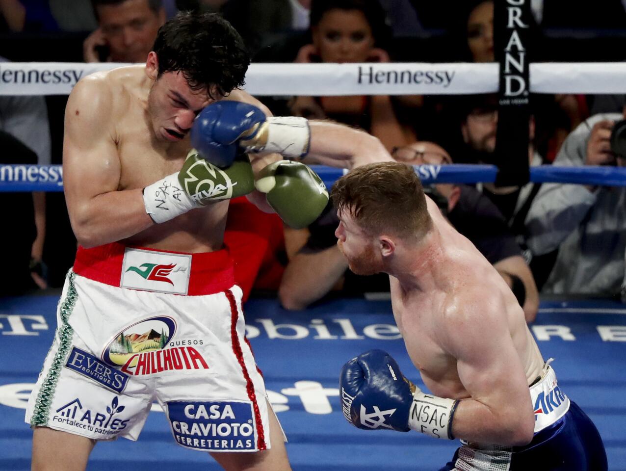 Canelo Alvarez lands a right against Julio Cesar Chavez Jr. during their fight in Las Vegas.