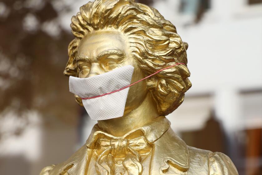A bust of Ludwig van Beethoven gets a mask in Bonn, Germany, where measures to fight the coronavirus pandemic are still in effect.