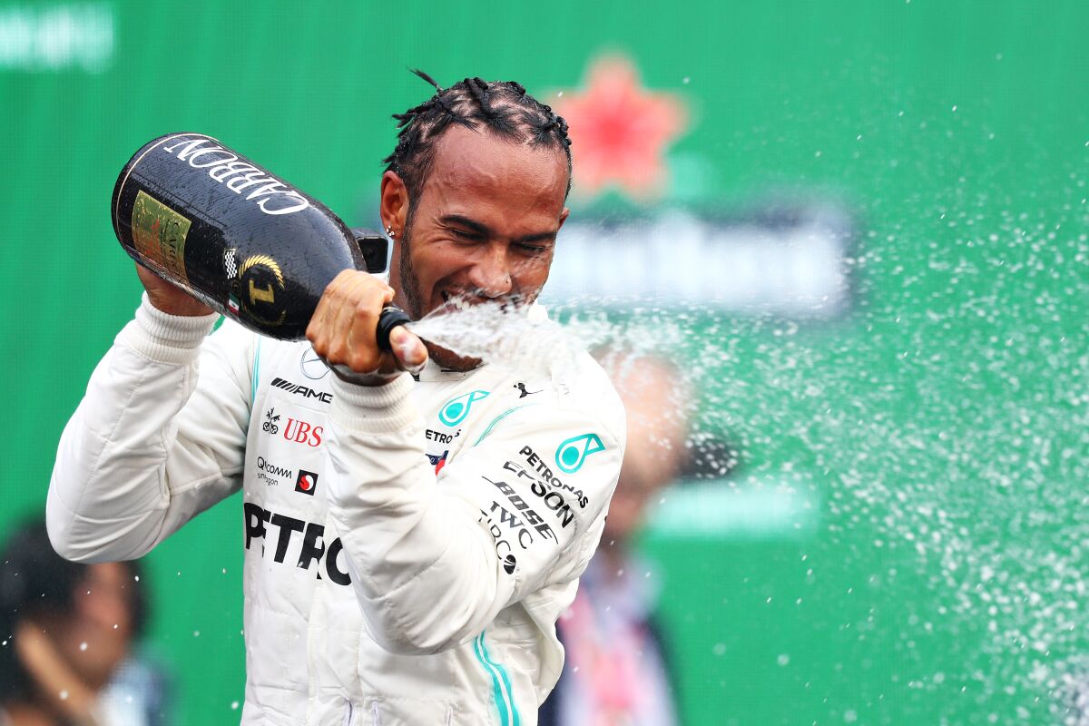 Mercedes driver Lewis Hamilton celebrates after winning the Formula One Grand Prix of Mexico on Sunday.
