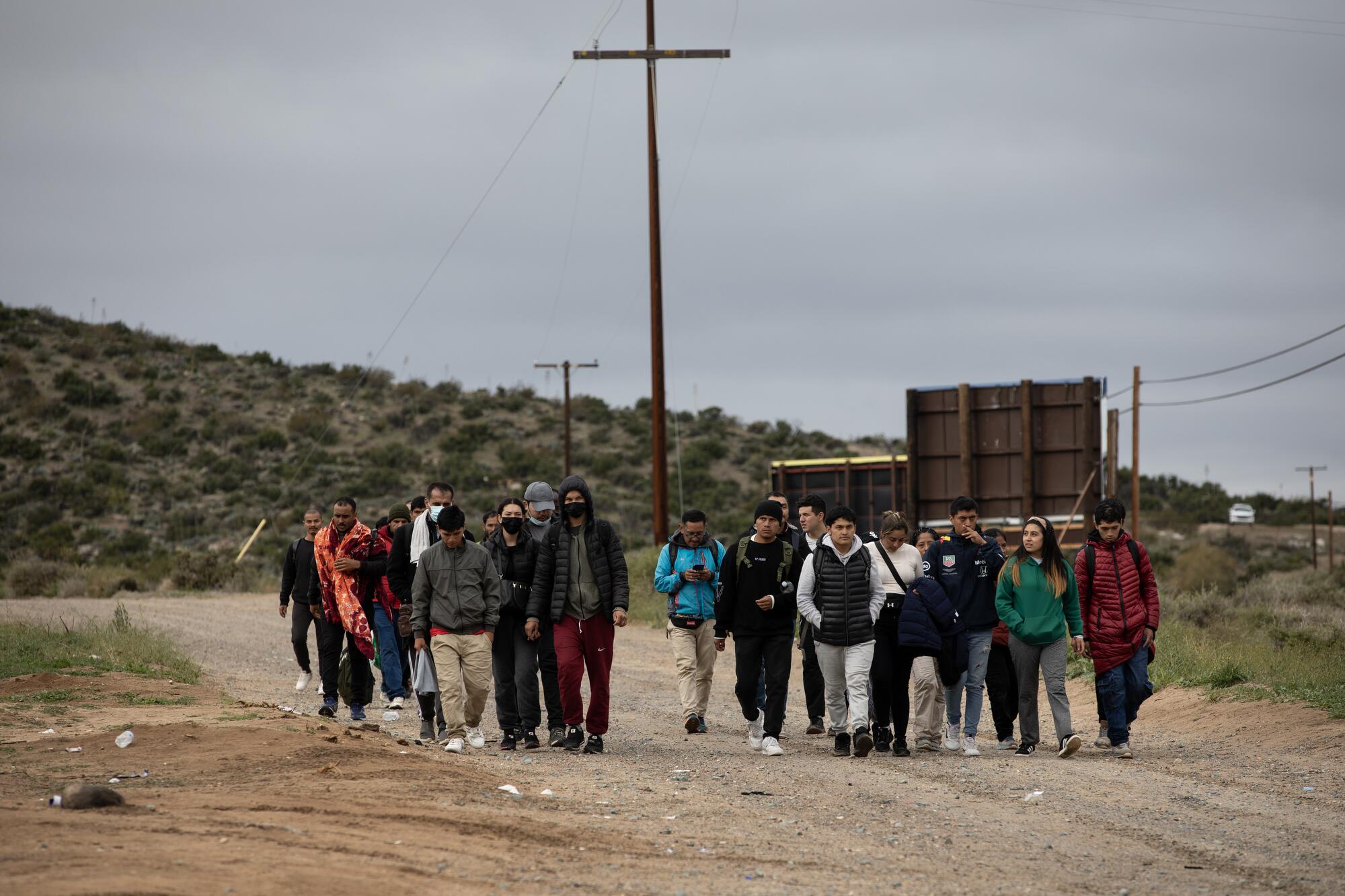 More than 60 migrants arrive at a camp just off Interstate 8