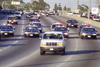 Caption:_ME.CHASE.8.0617.AS––BUENA PARK––California Highway _Patrol chase Al Cowlings, driving, and O.J. Simpson, hiding in _rear of white Bronco Friday on the 91 Freeway, just West of the I–_5 freeway. The chase ended in Simpson's arrest at his Brentwood _home. Mandatory Credit: AL SCHABEN/THE LOS ANGELES TIME