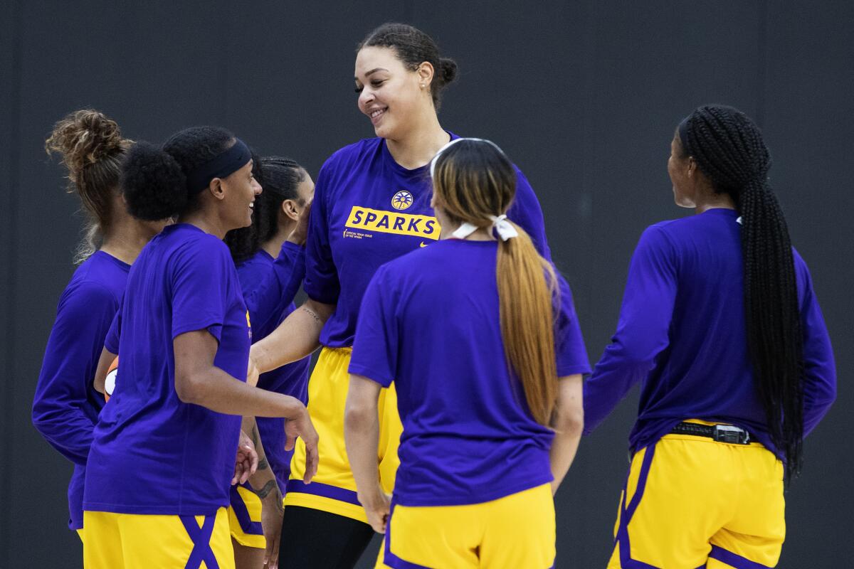 Sparks center Liz Cambage smiles during a practice session with teammates in April.