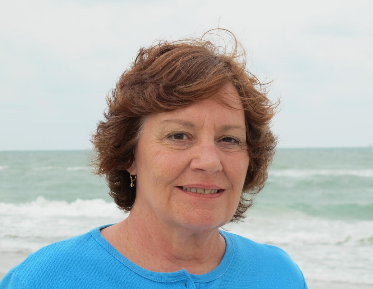 Carolyn Alden on the beach in Naples, Florida in 2013