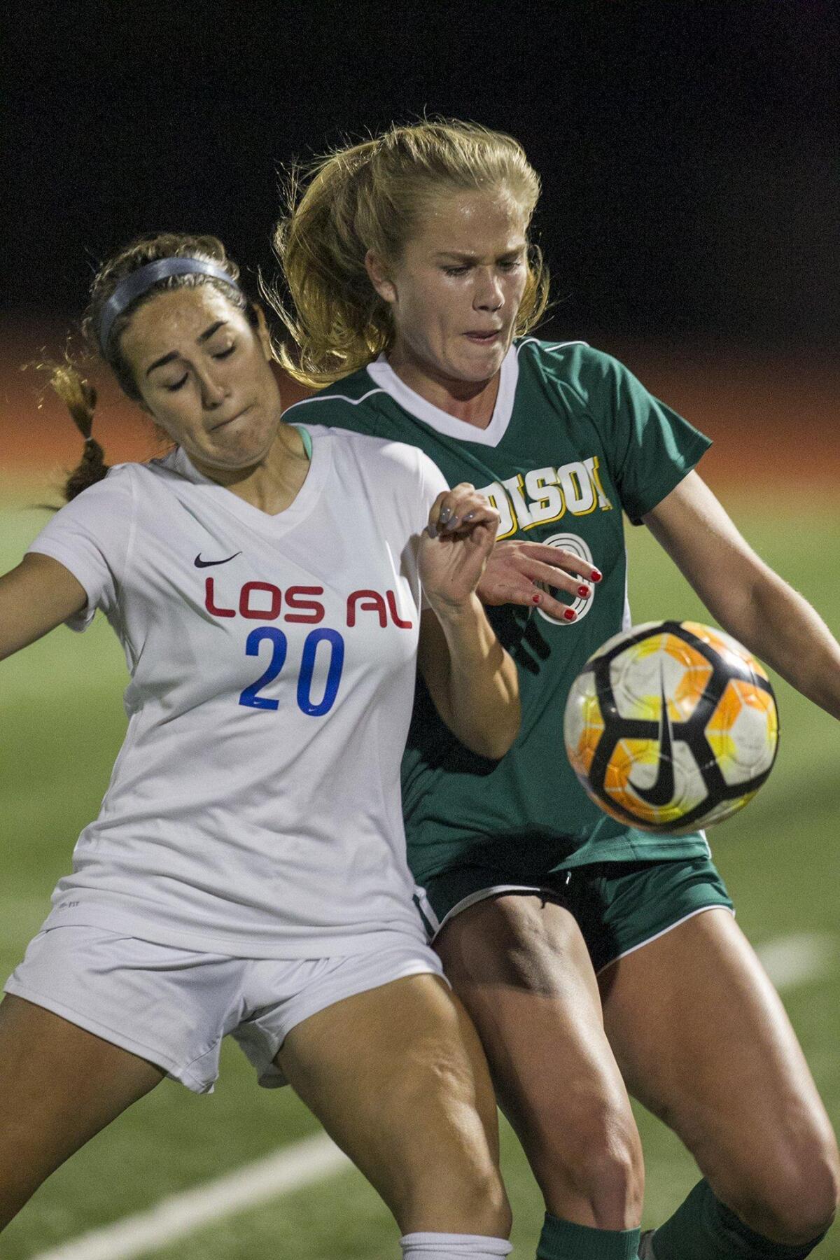 Edison High’s Mikayla Edwards fights for a ball against Los Alamitos' Morgan Meza.