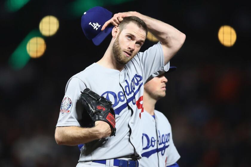 SAN FRANCISCO, CA - APRIL 27: Tony Cingrani #54 of the Los Angeles Dodgers scratches his head after giving up a RBI double to Kelby Tomlinson #37 of the San Francisco Giants in the seventh inning at AT&T Park on April 27, 2018 in San Francisco, California. (Photo by Ezra Shaw/Getty Images) ** OUTS - ELSENT, FPG, CM - OUTS * NM, PH, VA if sourced by CT, LA or MoD **