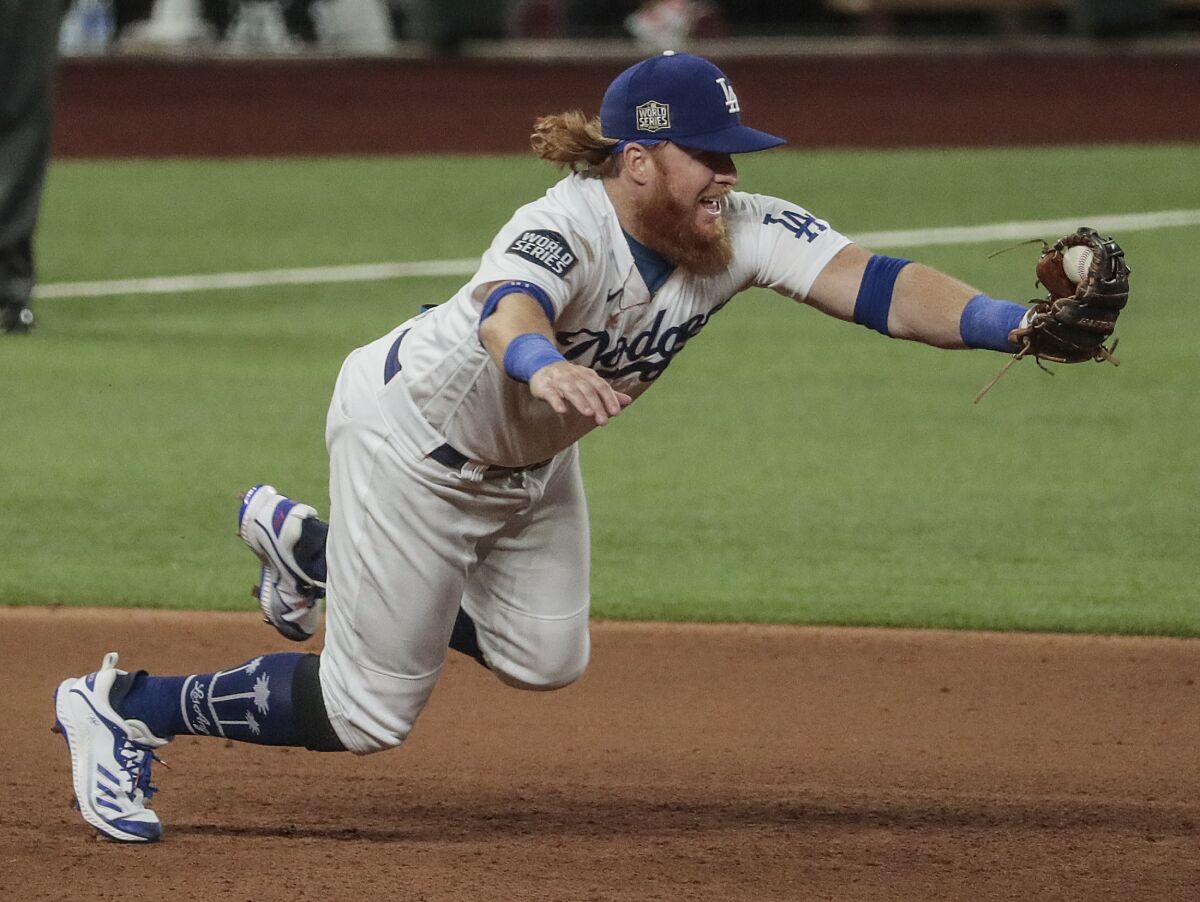 Dodgers third baseman Justin Turner snags a ground ball during Game 1 of the World Series on Oct. 20, 2020. 