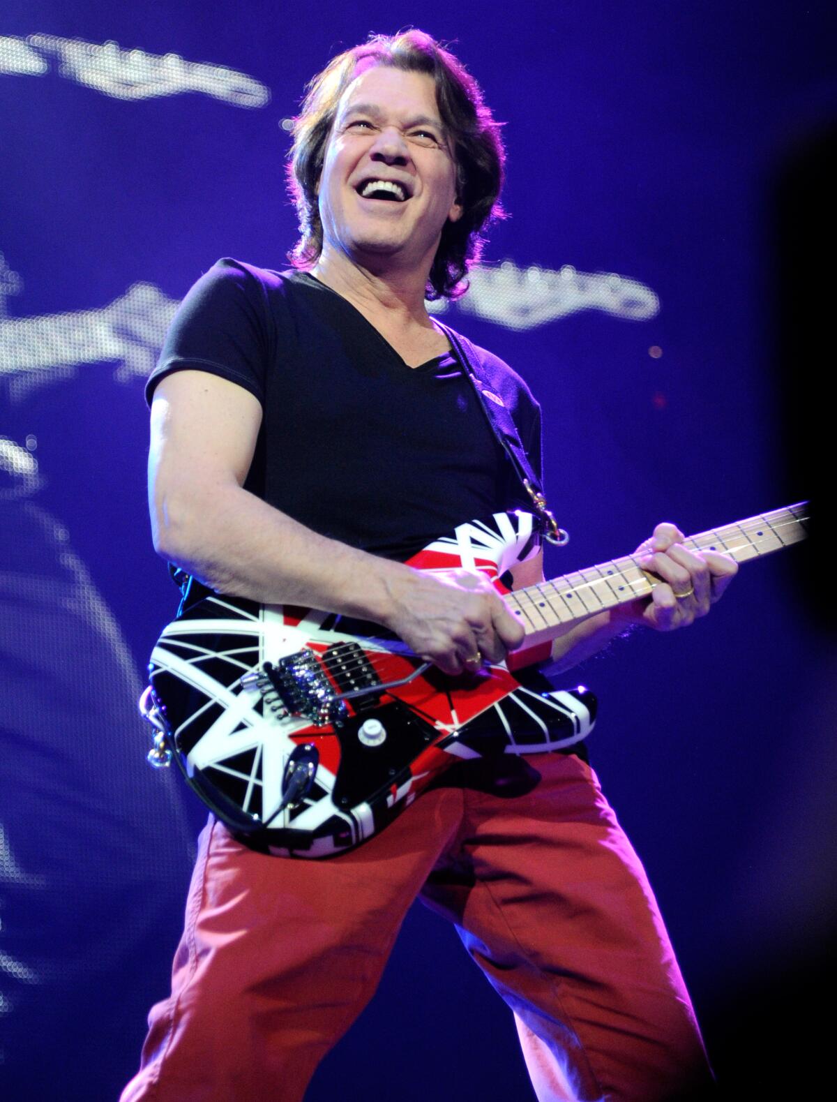 Eddie Van Halen playing guitar in 2012.