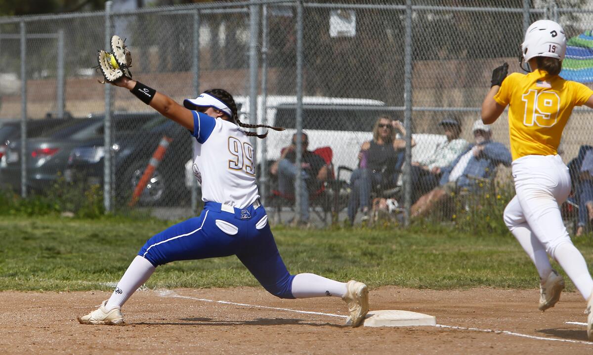 Fountain Valley's Veronica Moore, left, secures an out at first base against Ocean View's Sienna Erksine.