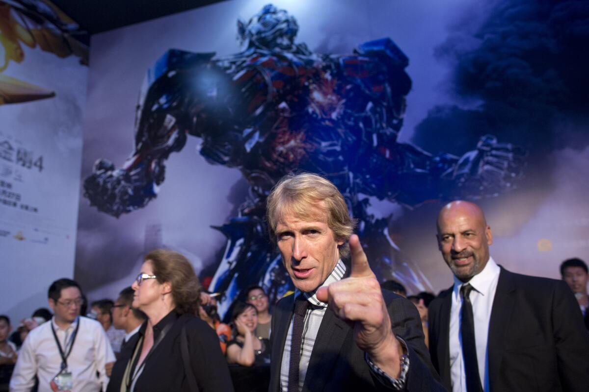 A Benghazi drama directed by Michael Bay -- pictured at the 2014 Beijing opening of "Transformers: Age of Extinction" -- is set to open over the Martin Luther King Jr. holiday next year.