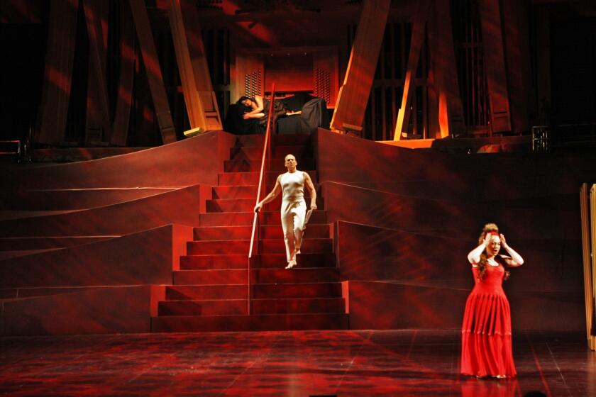 Simone Osborne, from top, Christopher Maltman and Dorothea Roschmann perform during a dress rehearsal on May 13 of Mozart's opera, "The Marriage of Figaro," at the Walt Disney Concert Hall. Noted architect Jean Nouvel built the sets and fashion designer Azzedine Alaia provides the costumes for the production being conducted by Gustavo Dudamel.
