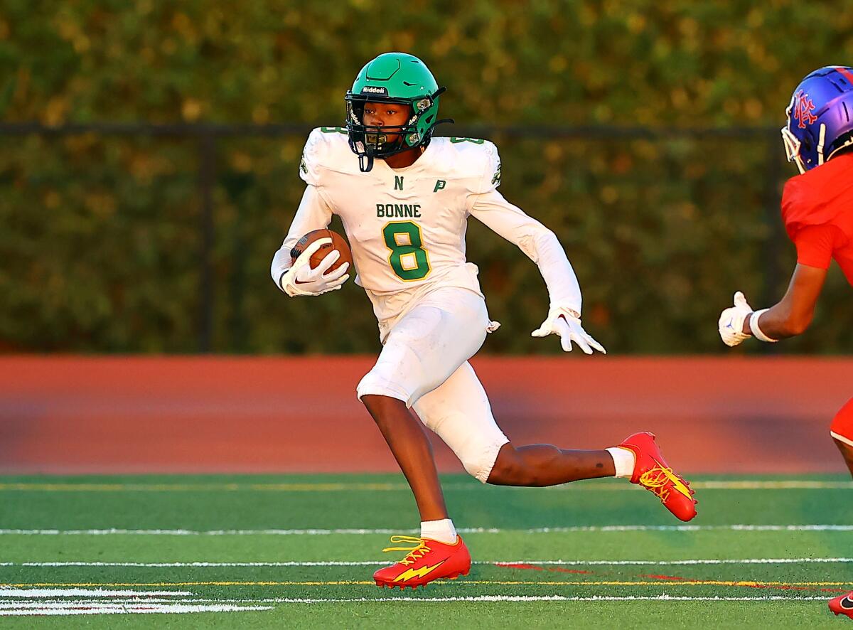 Receiver Da'Mari Hall of Narbonne tries to evade a defender after making a catch.