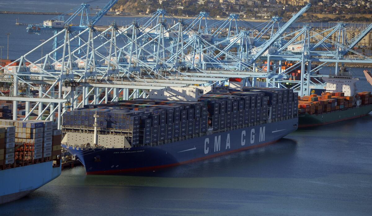 The CMA CGM Benjamin Franklin, the largest container ship ever to call at a North American port, unloads its cargo at the Port of Los Angeles in San Pedro on Dec. 26.