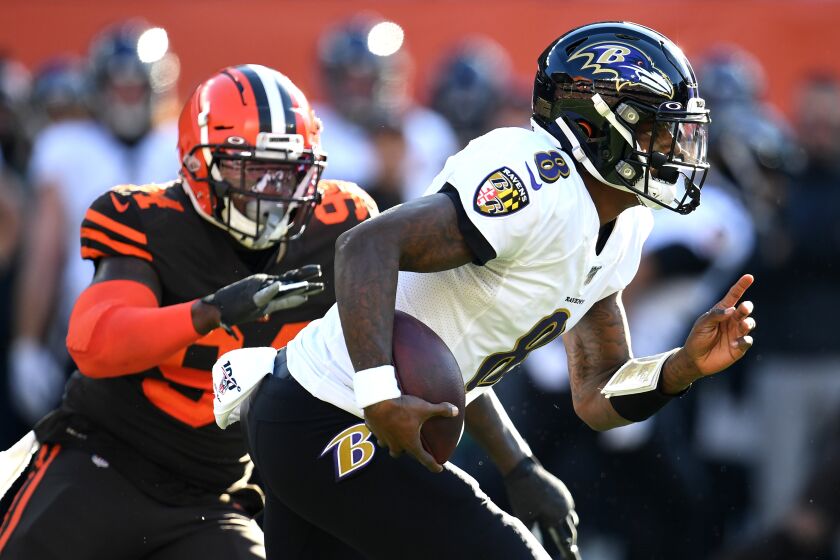 CLEVELAND, OHIO - DECEMBER 22: Lamar Jackson #8 of the Baltimore Ravens runs the ball against the Cleveland Browns during the first half in the game at FirstEnergy Stadium on December 22, 2019 in Cleveland, Ohio. (Photo by Jason Miller/Getty Images)