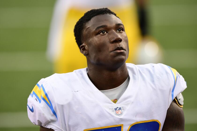 Los Angeles Chargers linebacker Kenneth Murray (56) looks on as he exits the field after an NFL football game against Cincinnati Bengals, Sunday, Sept. 13, 2020, in Cincinnati. (AP Photo/Emilee Chinn)