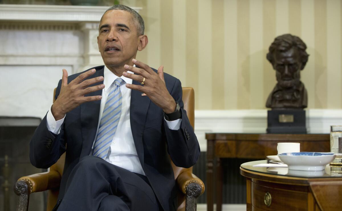 President Obama talks to reporters in the Oval Office on Feb. 17.