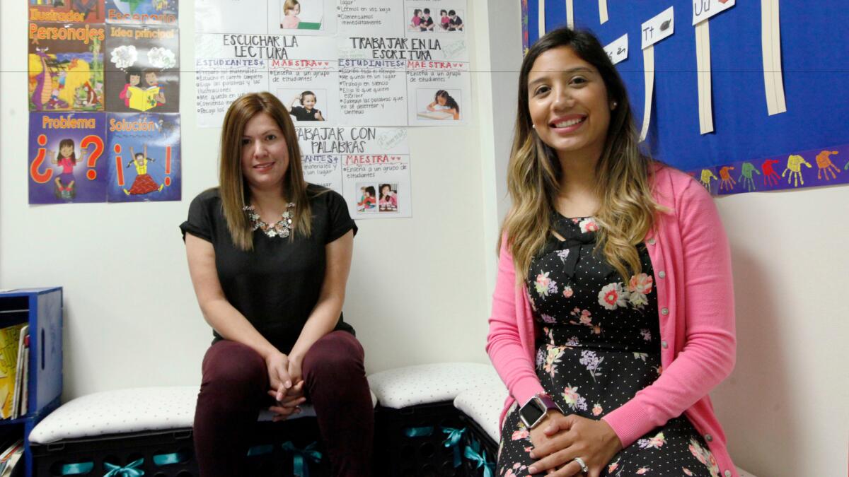 Two language teachers at Hogg Elementary in Dallas where school district recently began offering bilingual classes pairing native English speakers with native Spanish speakers.