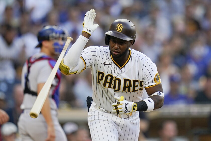 San Diego Padres' Jurickson Profar tosses his bat as he flies out while batting.