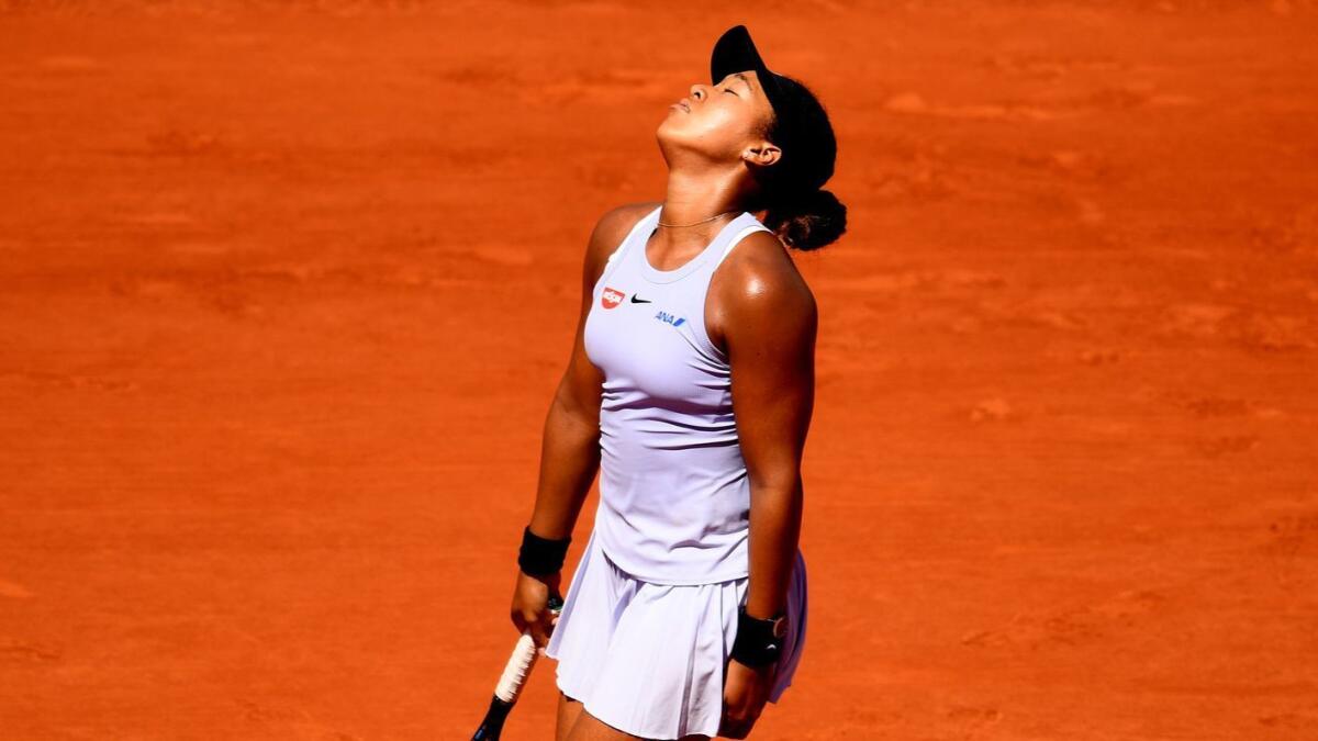 Naomi Osaka reacts during her loss to Katerina Siniakova in the third round of the French Open on June 1.