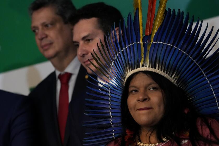 Brazil's newly-named Minister of Indigenous Peoples Sonia Guajajara attends a meeting where Brazil's President-elect Luiz Inacio Lula da Silva announced the ministers for his incoming government, in Brasilia, Brazil, Thursday, Dec. 29, 2022. Lula will be sworn-in on Jan. 1, 2023. (AP Photo/Eraldo Peres)
