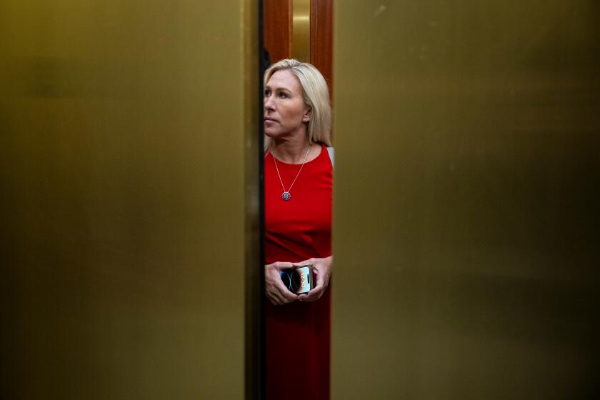 Representative Marjorie Taylor Greene, a Republican from Georgia, on an elevator following a House Homeland Security Committee hearing in Washington, DC, US, on Wednesday, Jan. 10, 2024. The committee is moving forward with a fast-paced impeachment bid against Homeland Security Secretary Alejandro Mayorkas, which may play out in a matter of weeks, following Republicans' concerted effort to use turmoil at the border as a primary line of attack against President Joe Biden in the lead-up to the November elections. Photographer: Graeme Sloan/Bloomberg via Getty Images
