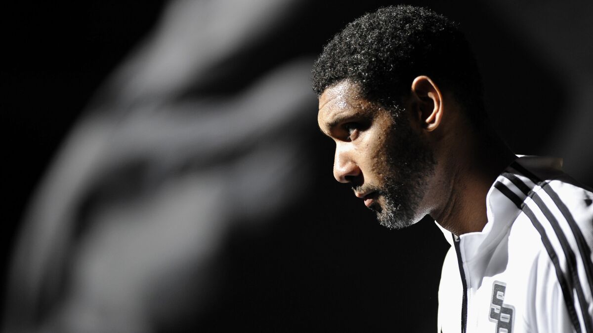 San Antonio Spurs forward Tim Duncan takes the court before the start of an exhibition game against the Miami Heat on Oct. 18.