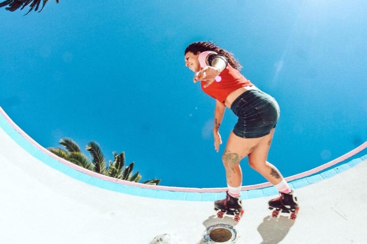 A roller skater on a curved wall