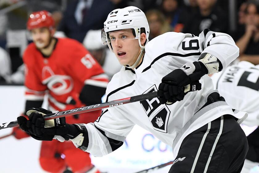 LOS ANGELES, CA - DECEMBER 02: Matt Luff #64 of the Los Angeles Kings watches his pass during the game against the Carolina Hurricanes at Staples Center on December 2, 2018 in Los Angeles, California. (Photo by Harry How/Getty Images)