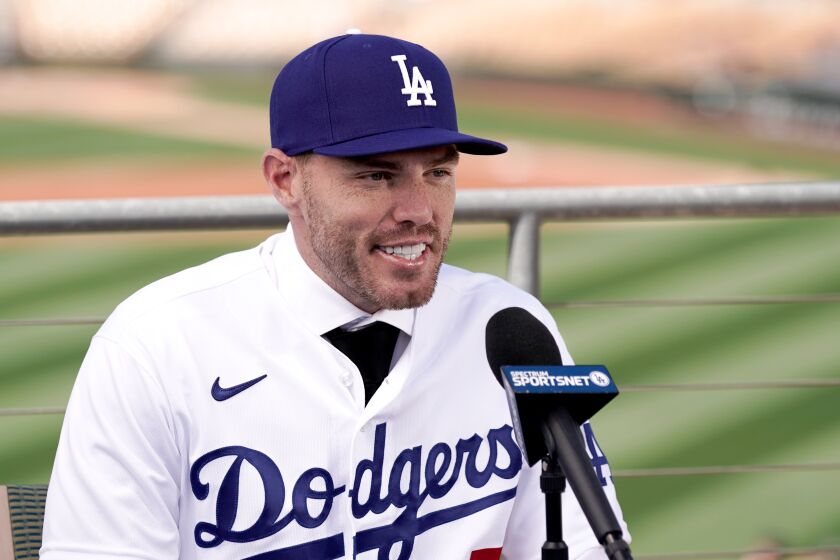 Los Angeles Dodgers' Freddie Freeman speaks during an introductory news conference at spring training baseball
