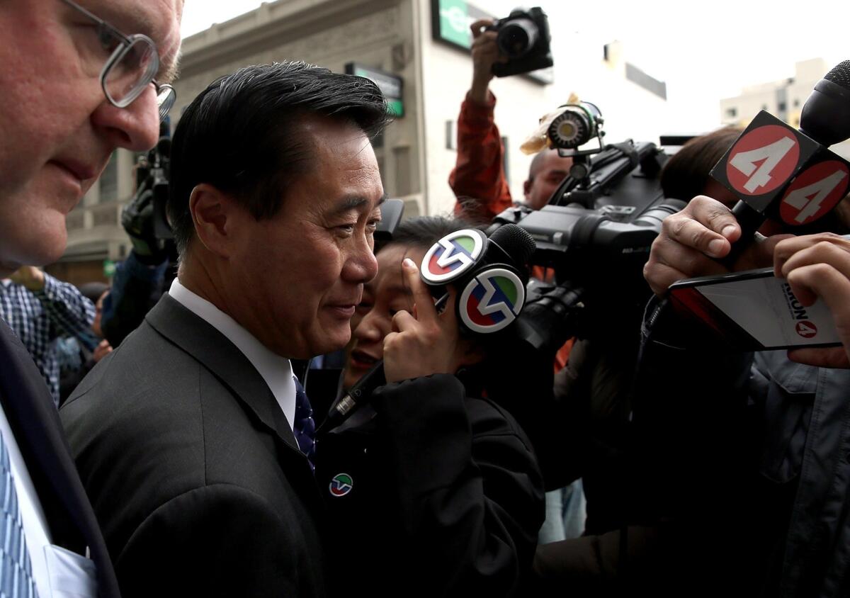 State Sen. Leland Yee (D-San Francisco) quit the race for California secretary of state after his arrest last month. Above, Yee faces reporters after a court appearance.