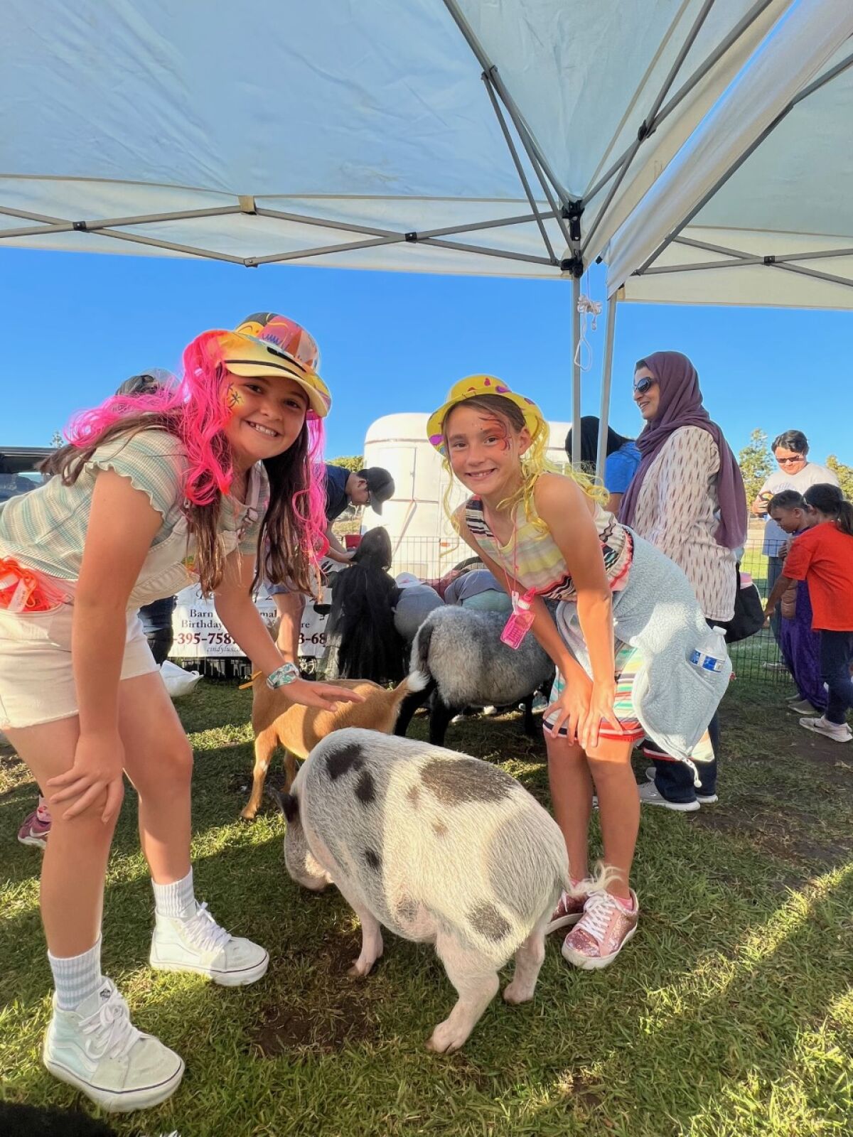 Sage Canyon students enjoy a petting zoo at the school carnival.