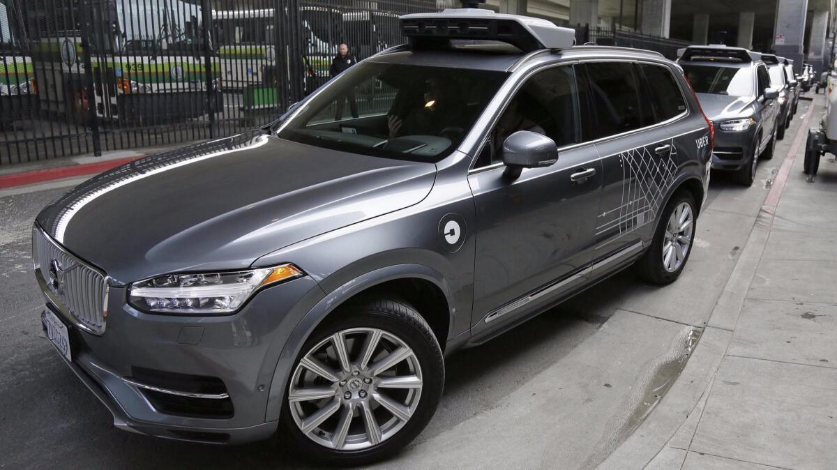 An Uber self-driving car heads out for a test drive in December.