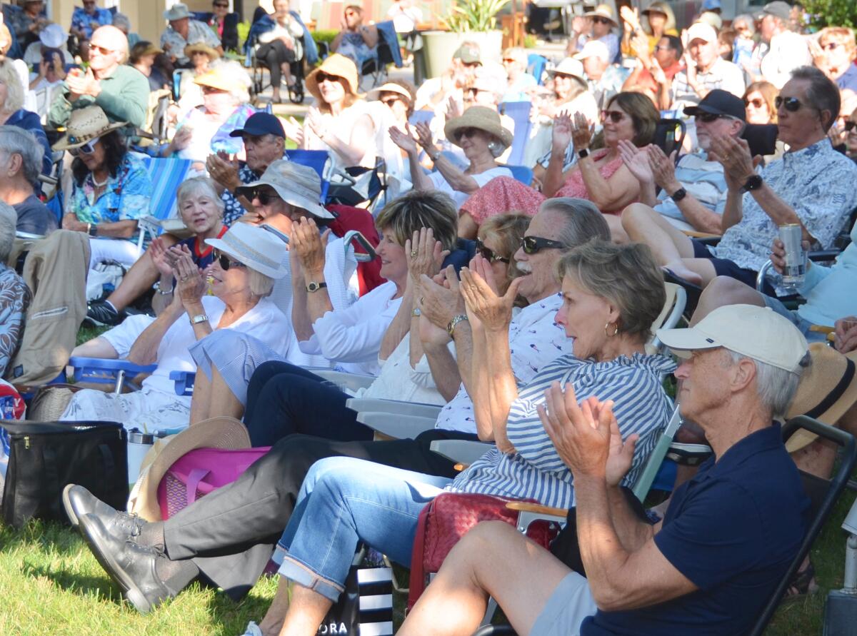 Attendees applaud at the Linda Ronstadt Revival concert at OASIS Senior Center.