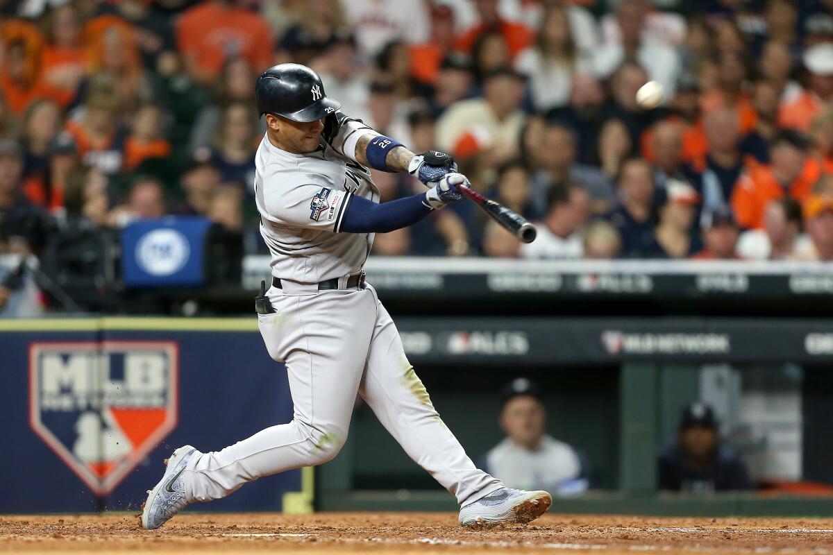 *** BESTPIX *** HOUSTON, TEXAS - OCTOBER 12: Gleyber Torres #25 of the New York Yankees hits a solo home run against the Houston Astros during the sixth inning in game one of the American League Championship Series at Minute Maid Park on October 12, 2019 in Houston, Texas. (Photo by Bob Levey/Getty Images) ** OUTS - ELSENT, FPG, CM - OUTS * NM, PH, VA if sourced by CT, LA or MoD **