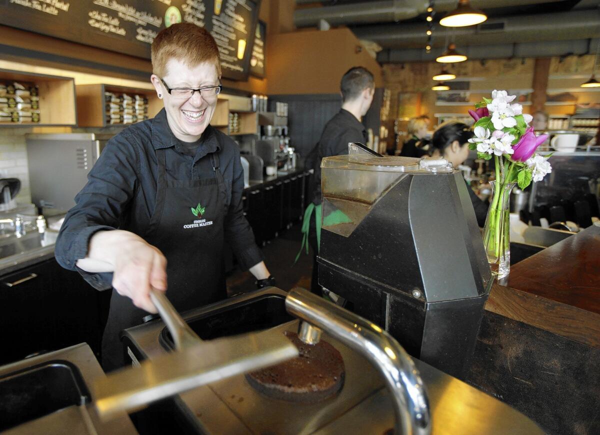 Starbucks employees using its tuition assistance program are not required to remain with the company after graduation. Above, barista Linsey Pringle at a Starbucks store in Seattle in 2012.