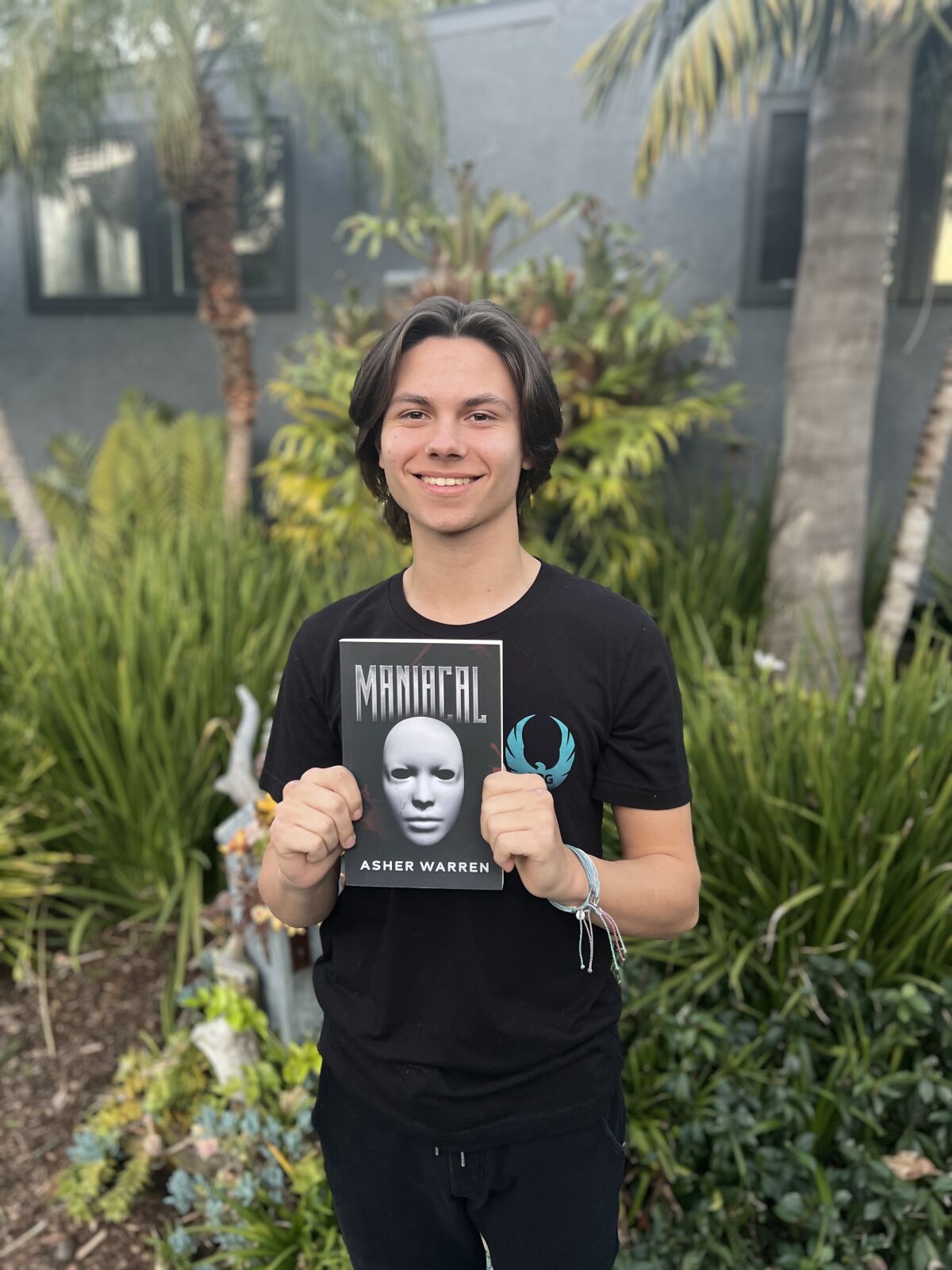 Asher Robinson with his new book "Maniacal."