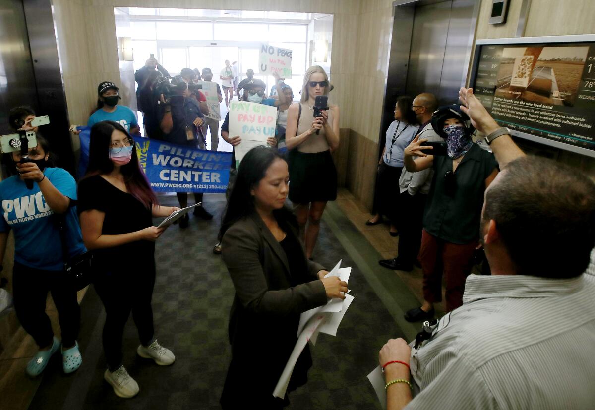 Homecare workers alleging wage theft picket the offices of a staffing agency in Long Beach in 2022.